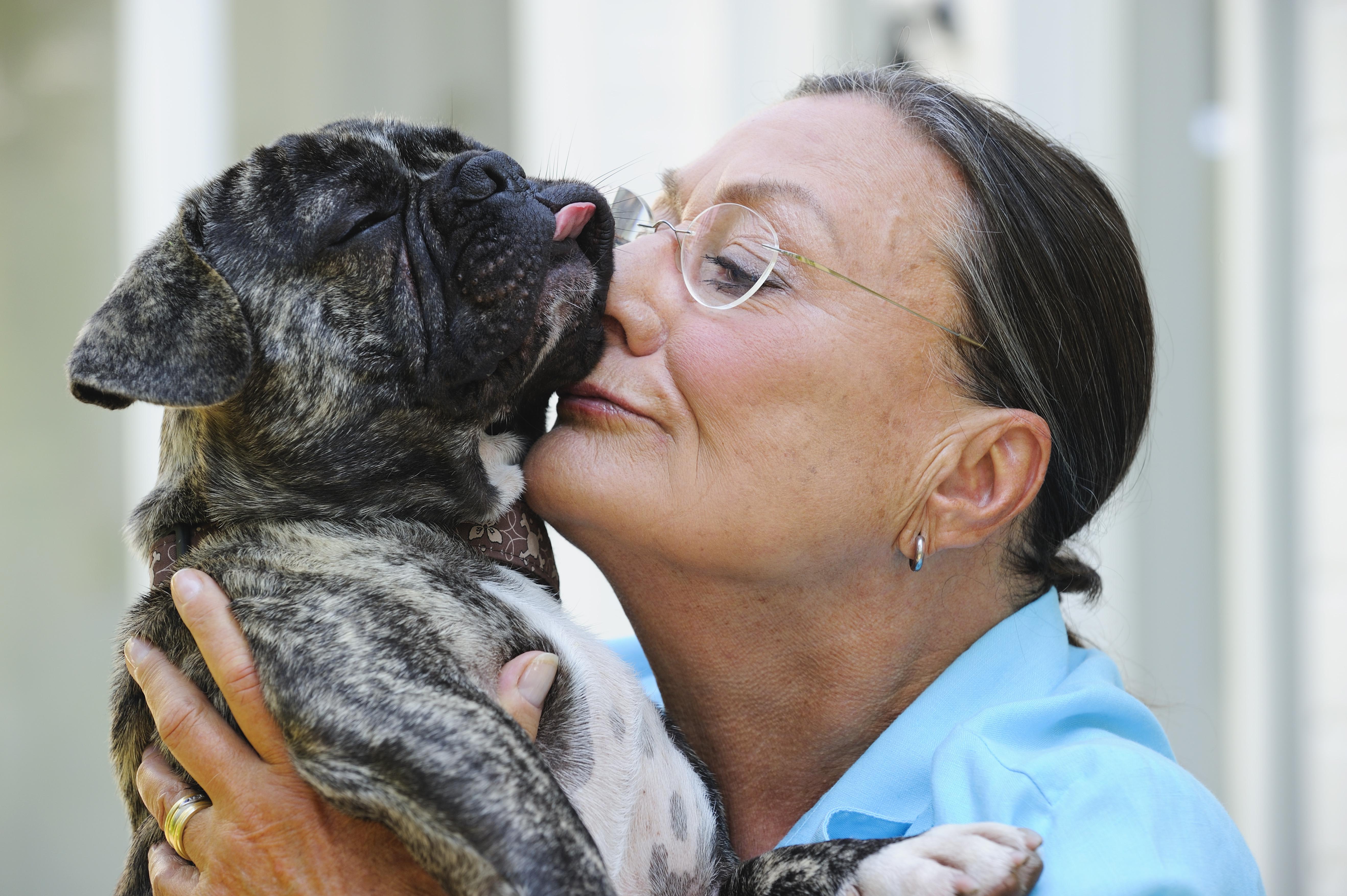 Affectionate senior woman with her pet dog